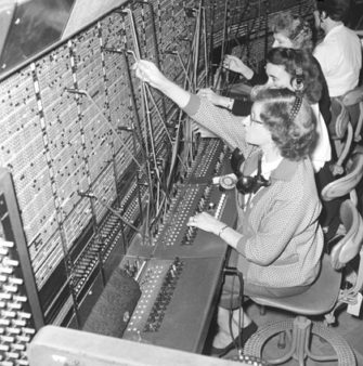 Black and white photograph of operators at a telephone exchange | Science Museum