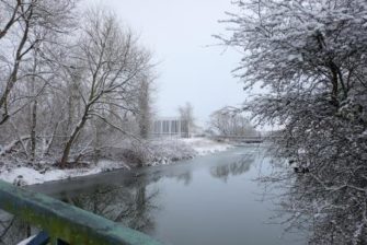 Distant view of ERO over the river in the snow | Essex Record Office